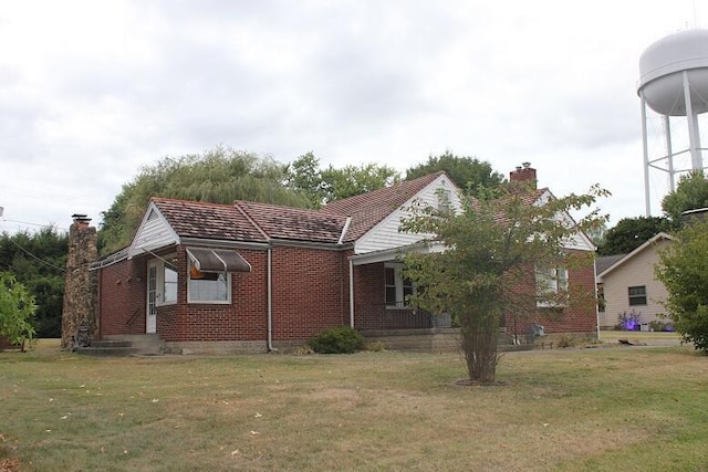 view of home's exterior featuring a yard