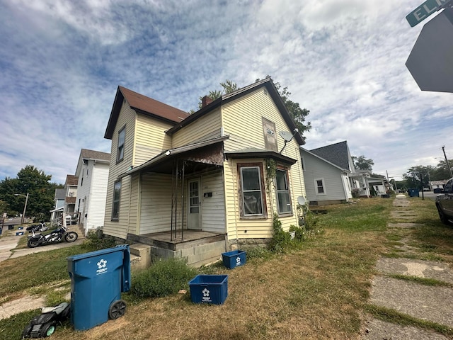 view of home's exterior with a yard