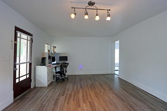 office with dark hardwood / wood-style flooring