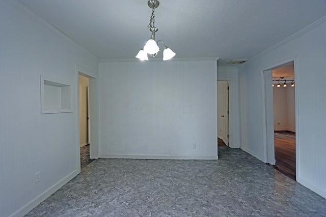 empty room with a chandelier and ornamental molding