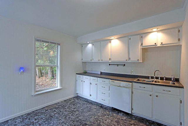 kitchen featuring dishwasher, a healthy amount of sunlight, white cabinetry, and sink