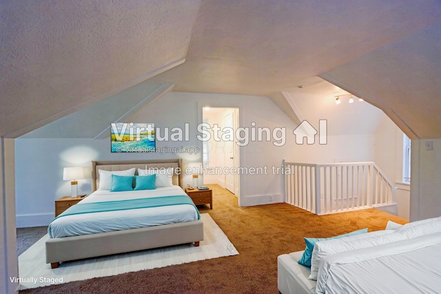 bedroom with carpet flooring, a textured ceiling, and vaulted ceiling