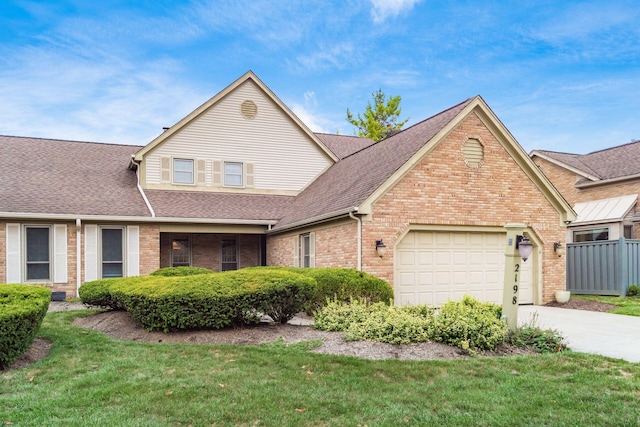 view of front facade featuring a front yard and a garage