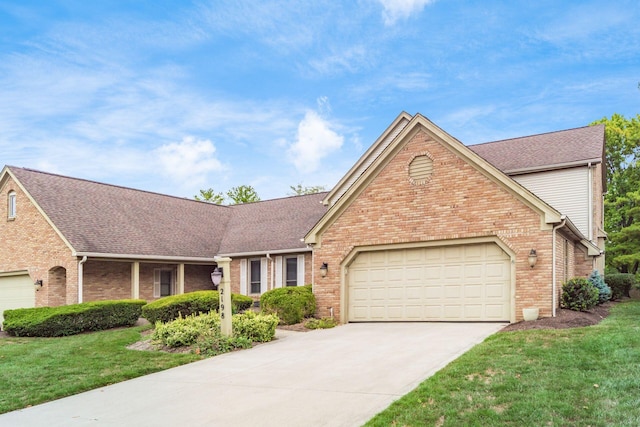 view of front of property featuring a garage and a front yard