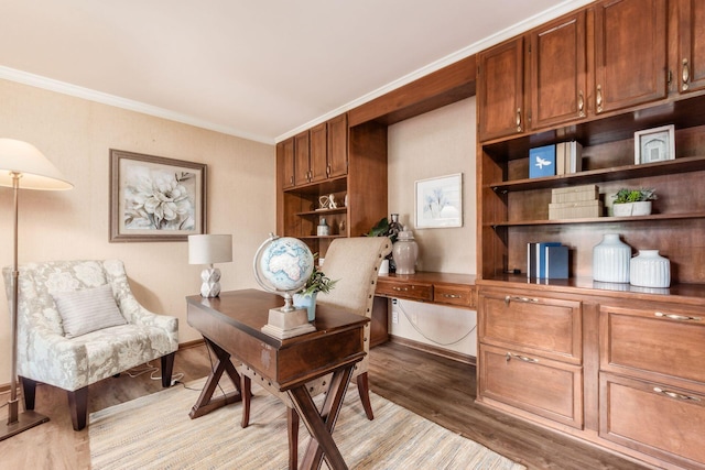 office space with light hardwood / wood-style floors and crown molding