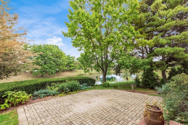 view of patio featuring a water view