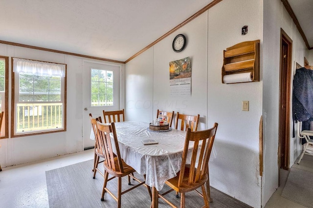 dining area with vaulted ceiling and ornamental molding