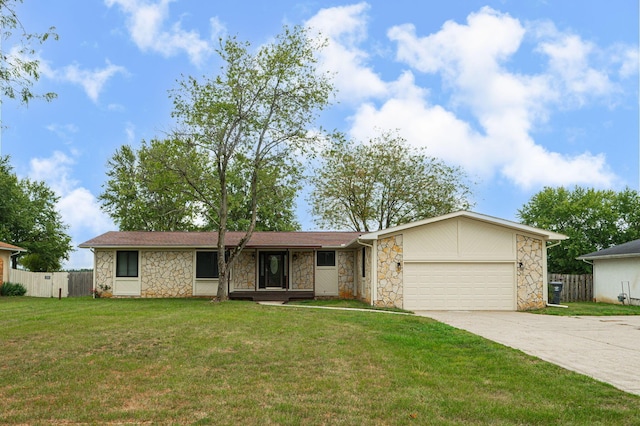 single story home featuring a front lawn and a garage