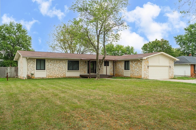 ranch-style home with a front yard and a garage