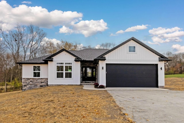 view of front of home featuring a garage and a front lawn