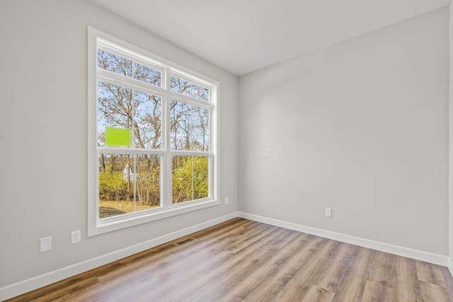 spare room featuring light wood-type flooring