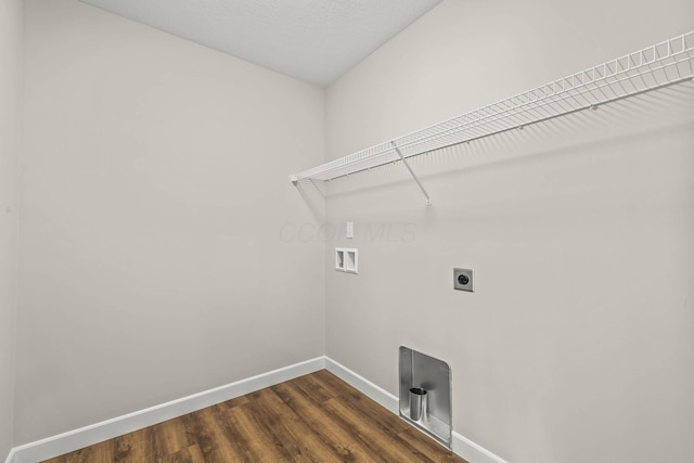 clothes washing area with electric dryer hookup, hookup for a washing machine, and dark hardwood / wood-style floors