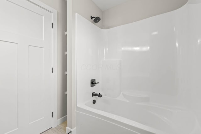 bathroom with shower / bathtub combination