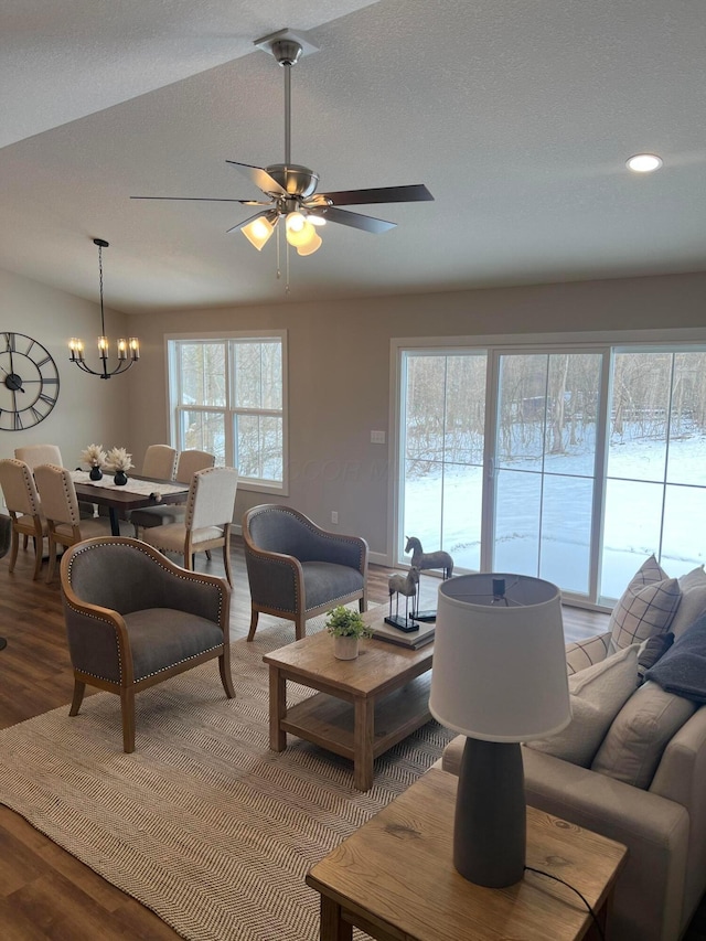 living room featuring a healthy amount of sunlight, hardwood / wood-style floors, and a textured ceiling