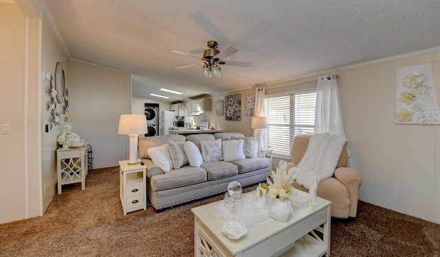 carpeted living room with stacked washer / drying machine, ceiling fan, crown molding, and a textured ceiling