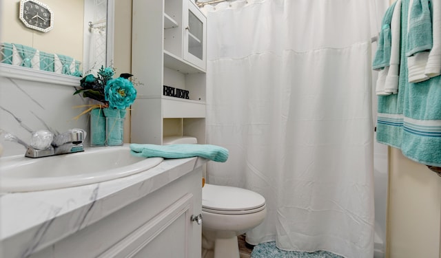 bathroom featuring hardwood / wood-style flooring, vanity, and toilet