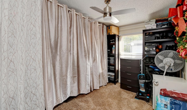 interior space featuring light colored carpet and ceiling fan