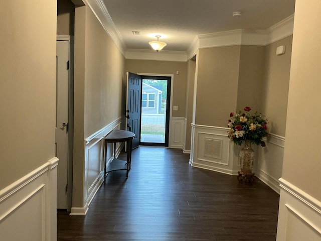 entryway featuring dark hardwood / wood-style floors and ornamental molding