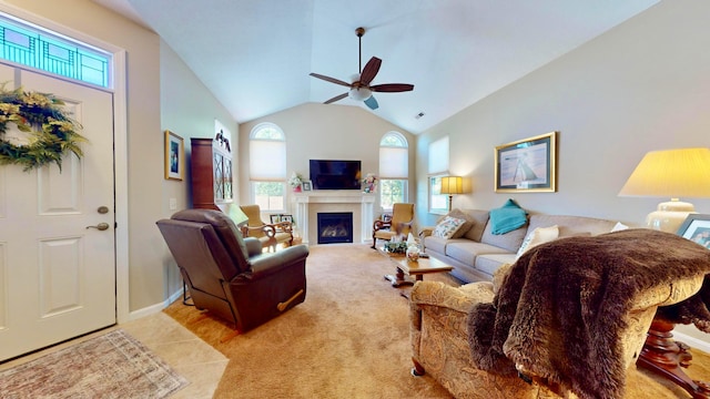 living room featuring ceiling fan, light carpet, and vaulted ceiling