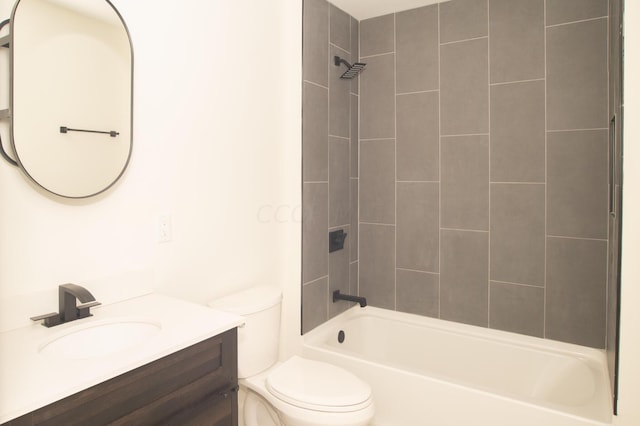 full bathroom with vanity, toilet, and tiled shower / bath