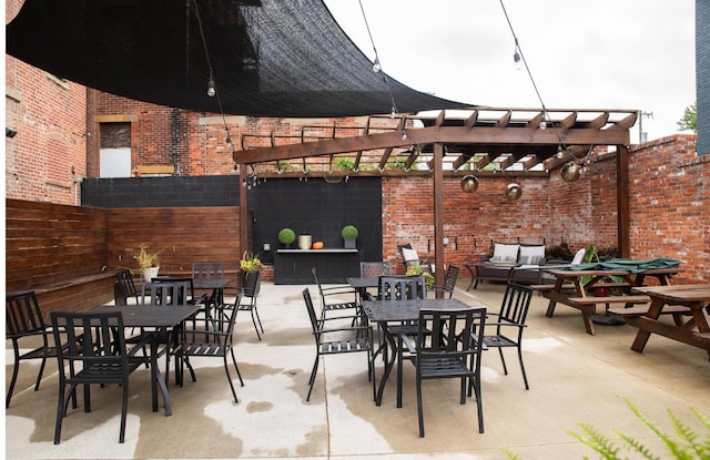 view of patio / terrace featuring a pergola and an outdoor living space