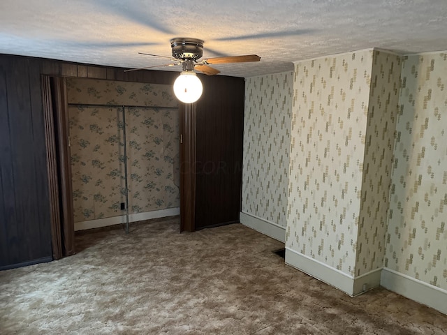 unfurnished bedroom featuring a textured ceiling and ceiling fan