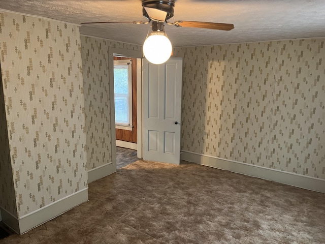 spare room with ceiling fan and a textured ceiling