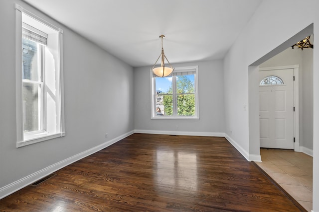 foyer with dark hardwood / wood-style floors