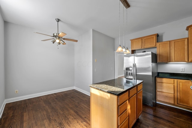 kitchen featuring a center island, decorative light fixtures, dark wood-type flooring, stainless steel fridge, and ceiling fan