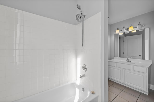 bathroom featuring vanity, tub / shower combination, and tile patterned floors