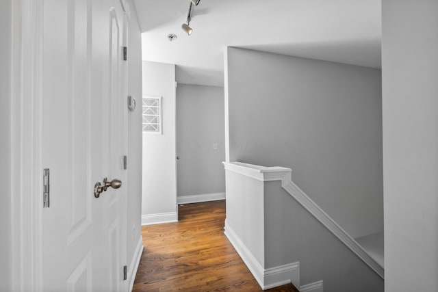 hall with dark wood-type flooring