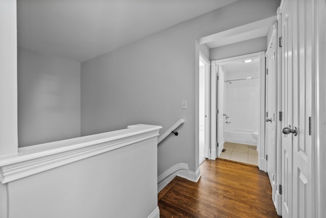 hall featuring dark wood-type flooring