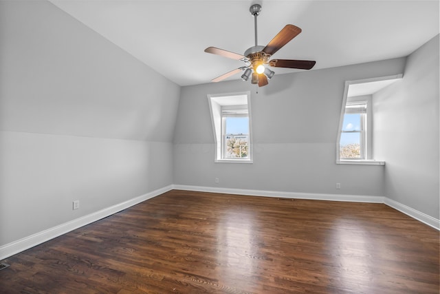 additional living space with ceiling fan, dark hardwood / wood-style flooring, and lofted ceiling