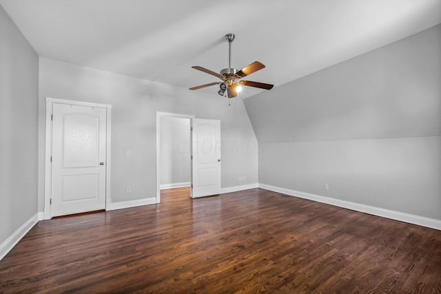 additional living space featuring lofted ceiling, ceiling fan, and dark wood-type flooring