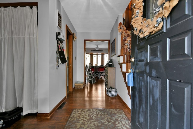 foyer entrance featuring dark hardwood / wood-style floors