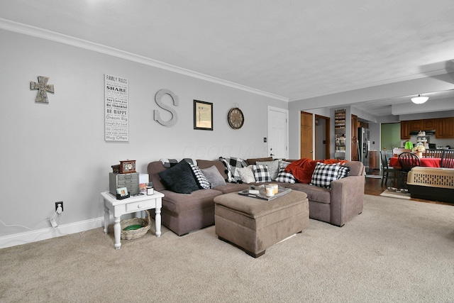 carpeted living room featuring ornamental molding