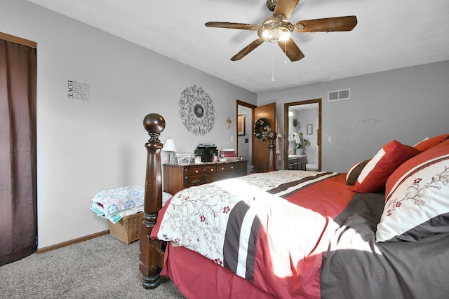 bedroom featuring connected bathroom, ceiling fan, and light colored carpet