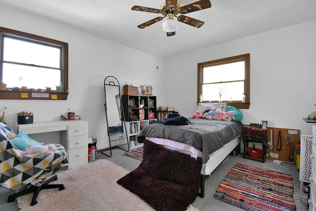 carpeted bedroom featuring ceiling fan