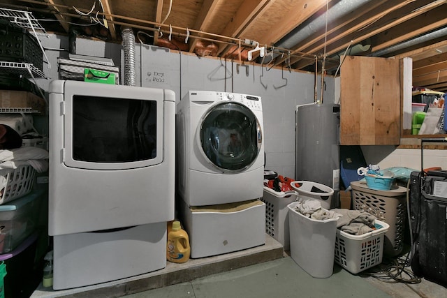 laundry area with separate washer and dryer and water heater