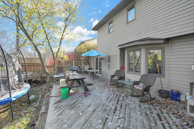 wooden terrace featuring a trampoline