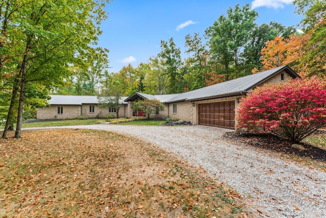 single story home featuring a garage