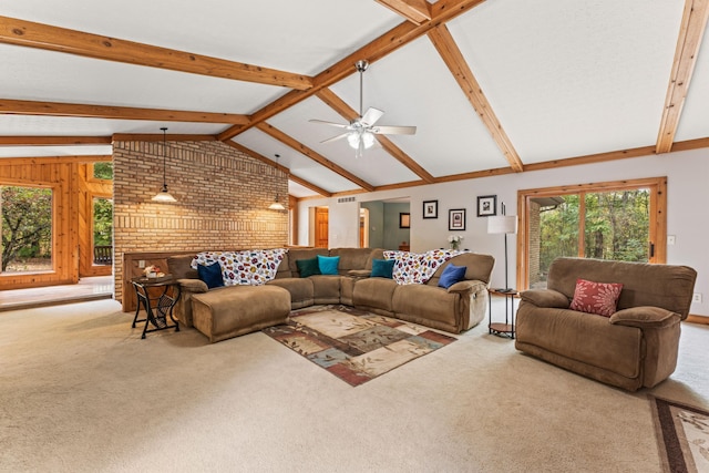 carpeted living room featuring vaulted ceiling with beams, a brick fireplace, ceiling fan, and wood walls