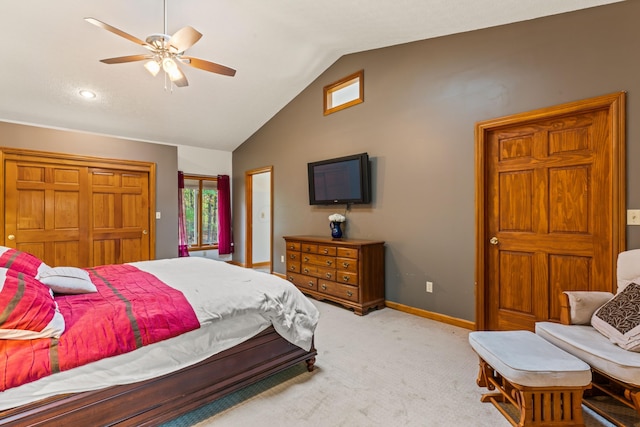 carpeted bedroom with vaulted ceiling and ceiling fan