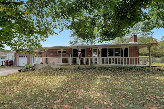 ranch-style house with a porch and a front lawn