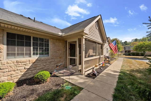 exterior space featuring a sunroom