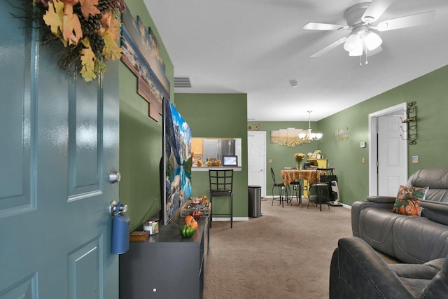 interior space with ceiling fan with notable chandelier