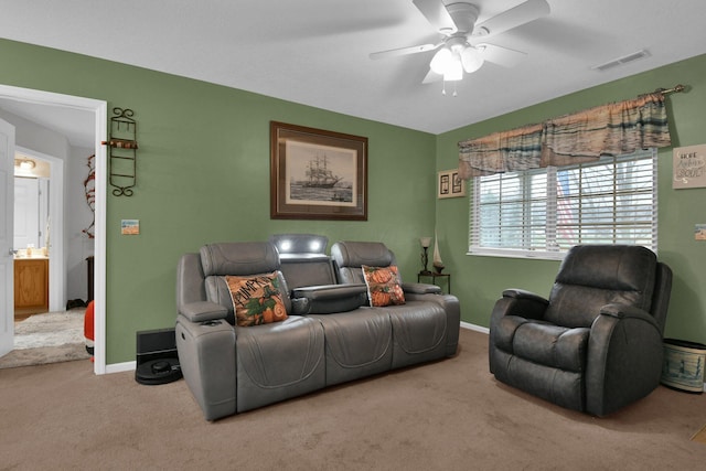 living room with carpet and ceiling fan