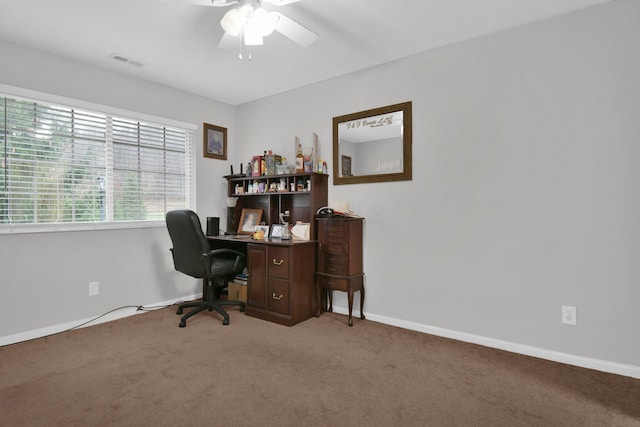 carpeted home office with ceiling fan