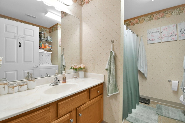 bathroom with tile patterned flooring and vanity