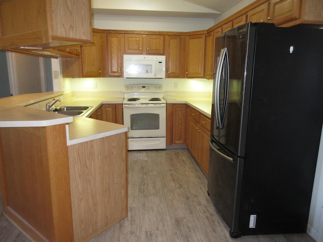 kitchen featuring kitchen peninsula, sink, light hardwood / wood-style floors, and white appliances